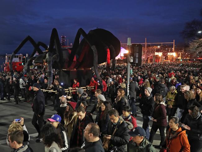 Thousands of people hit the waterfront to witness the parade of the Tasmanian cave spider Ogoh-Ogoh from Parliament Lawns to Dark Park. Picture: LUKE BOWDEN