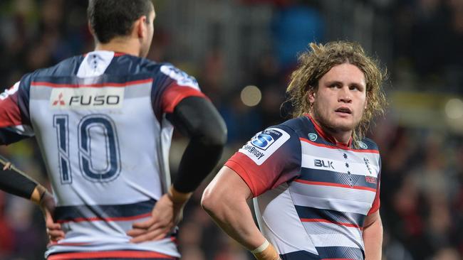 Jordy Reid of the Rebels looks dejected after conceding a try against the Crusaders.