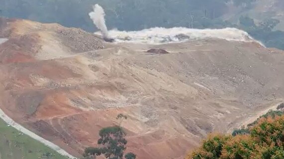 The first official blast as explosives are used to break up very hard rock to clear the way for the Coffs Harbour Bypass.