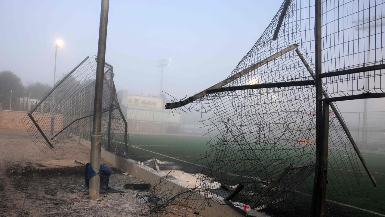 A damaged gate and debris are seen at a football pitch in Golan Heights. Picture: Menahem Kahana/AFP