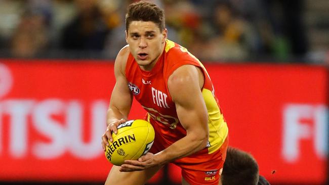 MELBOURNE, AUSTRALIA — JUNE 12: Dion Prestia of the Suns and Trent Cotchin of the Tigers in action during the 2016 AFL Round 12 match between the Richmond Tigers and the Gold Coast Suns at the Melbourne Cricket Ground on June 12, 2016 in Melbourne, Australia. (Photo by Michael Willson/AFL Media/Getty Images)