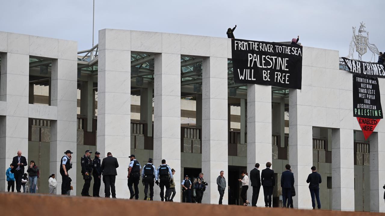 Pro-Palestine protesters scaled the roof of Parliament House in a show of support for Palestine. Picture: NewsWire/ Martin Ollman