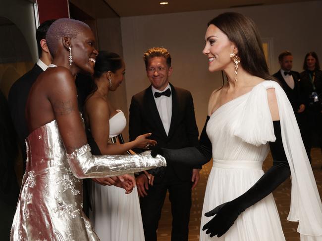 Britain's Catherine, Princess of Wales (R) speaks to EE Rising Star nominee Sheila Atim (L) during the BAFTA British Academy Film Awards at the Royal Festival Hall, Southbank Centre, in London, on February 19, 2023. (Photo by Chris Jackson / POOL / AFP)