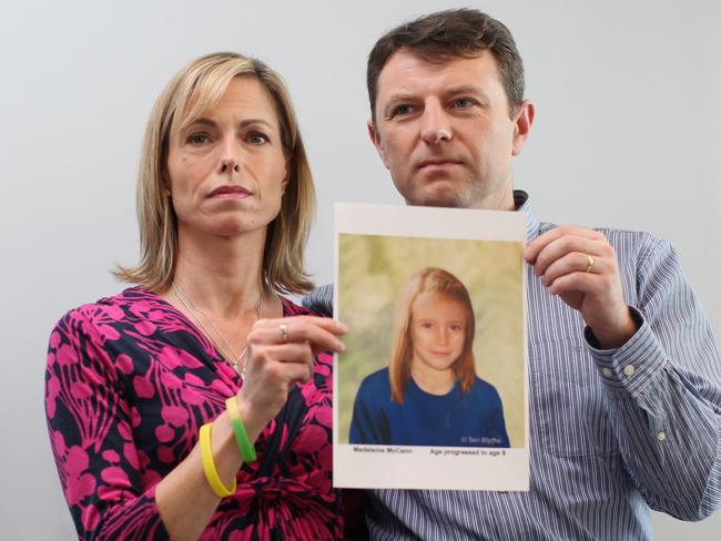  Kate and Gerry McCann hold an age-progressed police image of their daughter to mark the 5th anniversary of her disappearance. Picture: Getty 