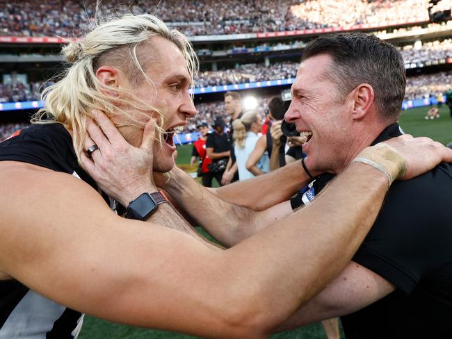 MELBOURNE, AUSTRALIA - SEPTEMBER 30: Darcy Moore of the Magpies and Craig McRae, Senior Coach of the Magpies celebrate during the 2023 AFL Grand Final match between the Collingwood Magpies and the Brisbane Lions at the Melbourne Cricket Ground on September 30, 2023 in Melbourne, Australia. (Photo by Michael Willson/AFL Photos via Getty Images)