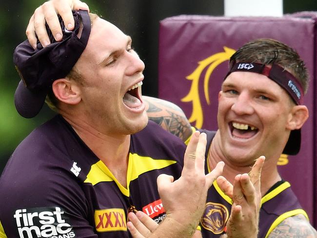 Matt Lodge (left) is seen with teammates Josh McGuire (centre) and Sam Thaiday (right) during a Brisbane Broncos training session at Clive Berghofer Field in Brisbane, Wednesday, March 7, 2018. The Broncos play the St George-Illawarra Dragons in the opening match of the 2018 NRL season on Thursday night in Sydney. (AAP Image/Darren England) NO ARCHIVING