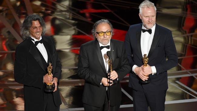 Makeup artists, from left, Giorgio Gregorini, Alessandro Bertolazzi and Christopher Nelson. Picture: Getty