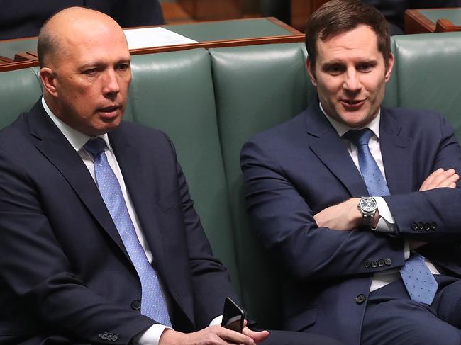 Peter Dutton and Alex Hawke  in the House of Representatives Chamber at Parliament House in Canberra. Picture Kym Smith