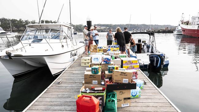 Ulladulla residents are using their own boats to take supplies to towns that are isolated due to the fires. Picture: Darren Leigh Roberts