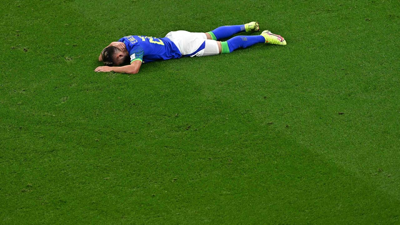 Brazil's midfielder Everton Ribeiro reacts after being tackled during a scoreless draw with Cameroon. (Photo by Anne-Christine POUJOULAT / AFP)