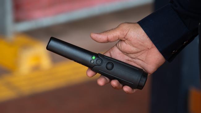 NT Police using wanding metal detectors. Picture: Pema Tamang Pakhrin