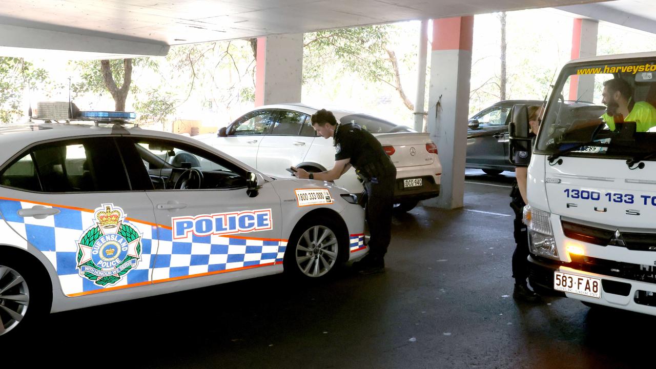 Police pictured after chasing a vehicle in a high speed pursuit to a shopping centre carpark at Redbank Plains in September. Picture: Steve Pohlner