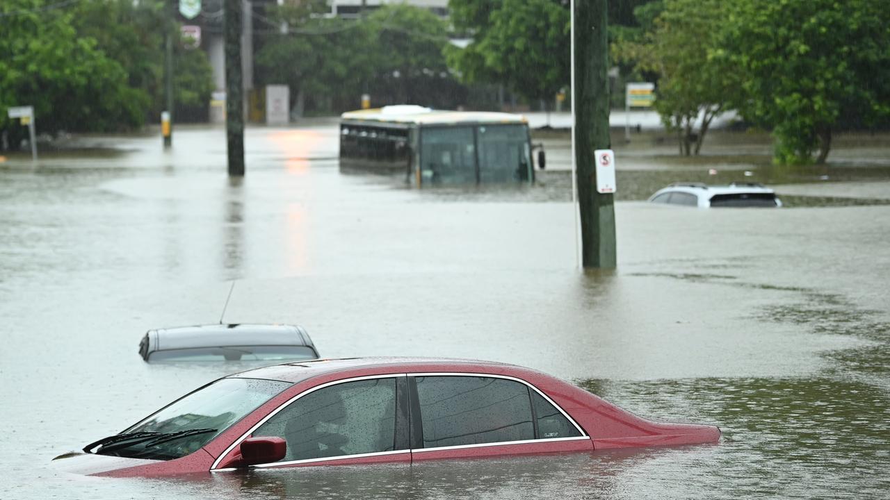 Cars and a bus underwater next to Suncorp stadium, in Milton, as floods and rain swamp Brisbane. Picture: Lyndon Mechielsen/The Australian