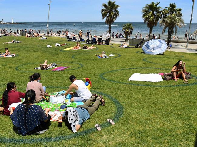 Families and friends get together for picnics as the restrictions ease. Picture: AFP