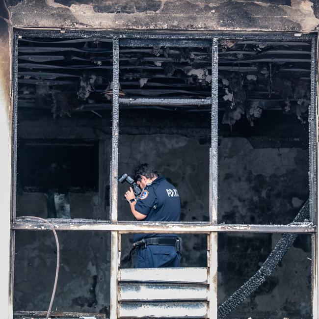 NTFES investigate the scene of the Chin Arcade Fire on Cavenagh St in July 2022. Picture: Glenn Campbell.