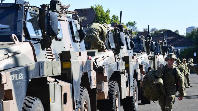 A convoy of Army vehicles, transporting up to 100 Army Reservists and self-sustainment supplies to Kangaroo Island at Keswick Barracks before departure. Picture: AAP / David Mariuz