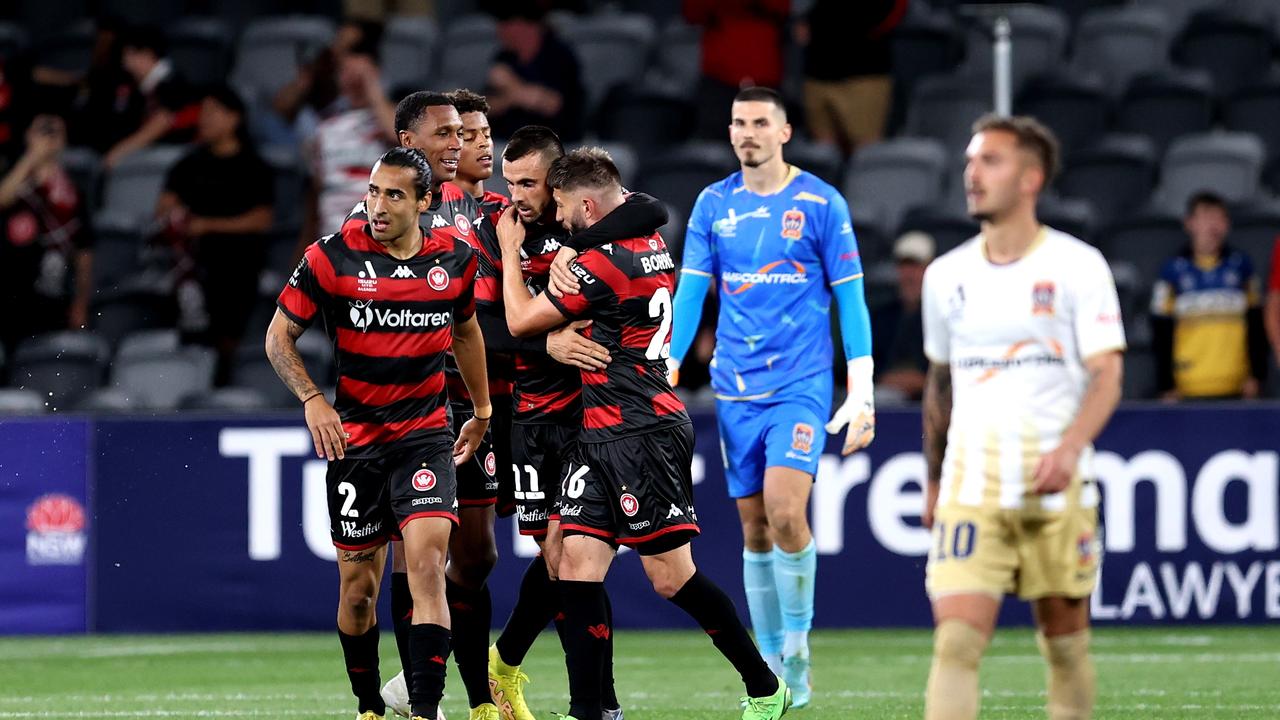 Brandon Borrello (centre) is congratulate by his Wanderers teammates after scoring. celebrates scoring. Picture: Brendon Thorne/Getty Images