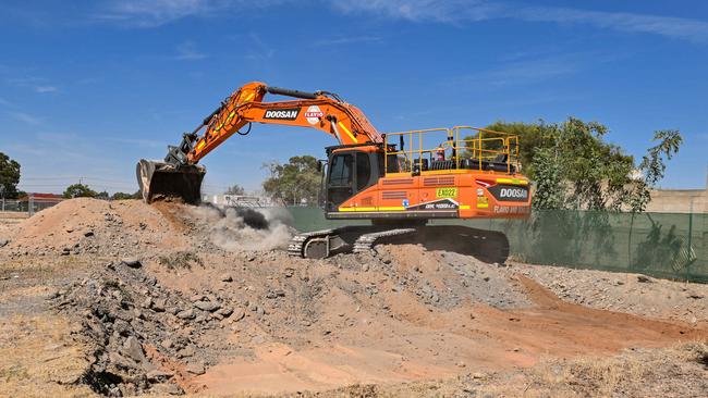 Excavators dig at an old factory site in a last-ditch attempt to find the remains of the three missing Beaumont children before the government-owned site is sold to developers. Picture: NewsWire / Brenton Edwards