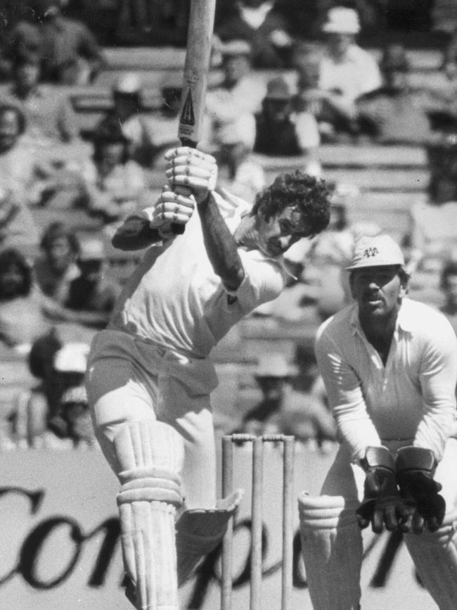 Victorian cricketer Jeff Moss lets fly as Rod Marsh waits in vain.