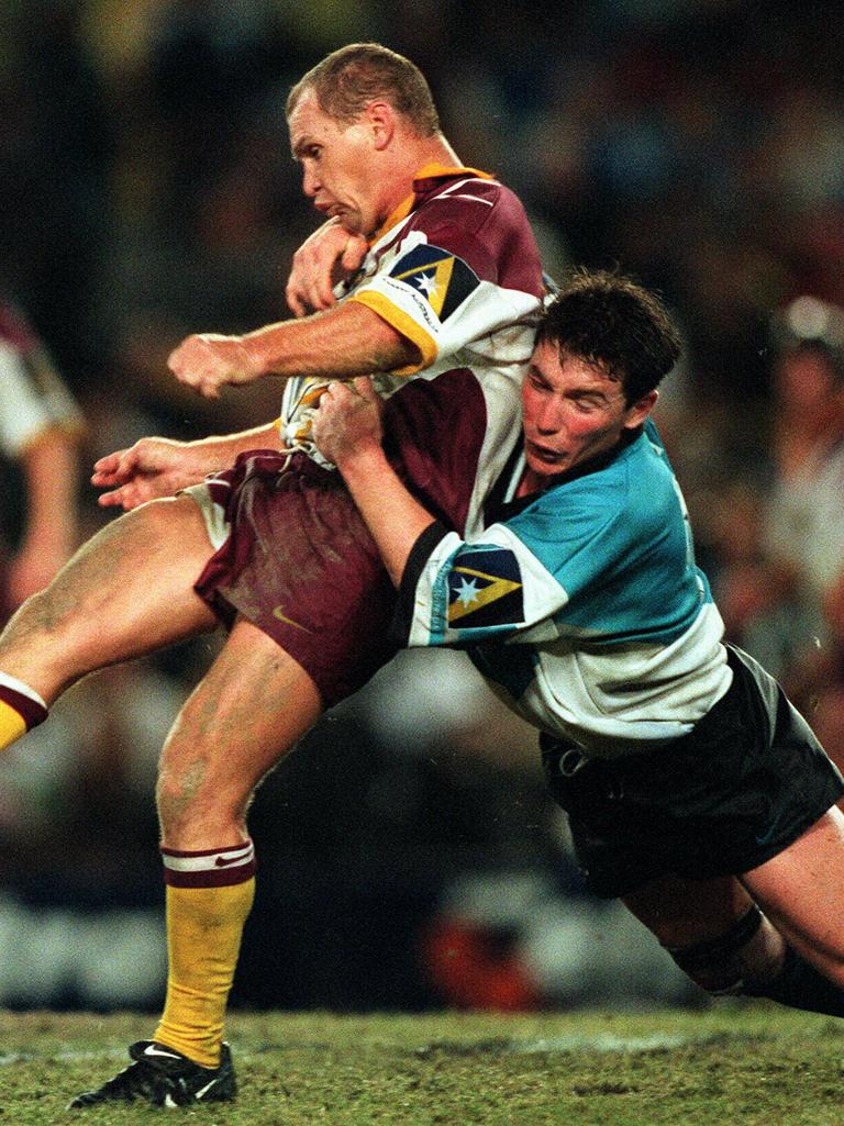 Paul Green tackles Allan Langer in 1997. Picture: David Kapernick