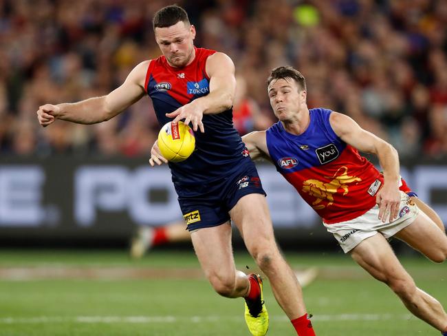 Demon Steven May evades Lincoln McCarthy of the Lions during the Second Semi Final match between the Melbourne and Brisbane at the Melbourne Cricket Ground on September 9. Photo Dylan Burns/AFL Photos via Getty Images