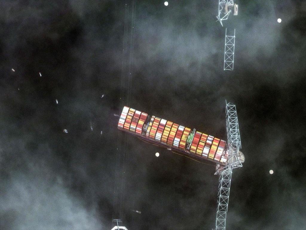 A satellite image released by Maxar Technologies shows Baltimore's Francis Scott Key Bridge after the Singapore-flagged Dali cargo ship smashed into the structure causing it to collapse. Picture: AFP