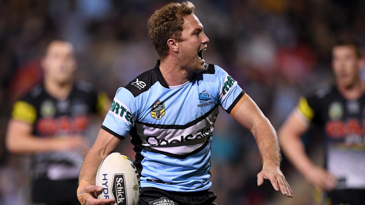 Matt Moylan of the Sharks celebrates after scoring a try against his old club. (AAP Image/Dan Himbrechts)