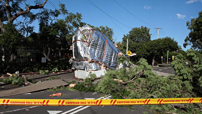 Classroom roof from North Parramatta school lays across power lines today. Picture: Adam Yip