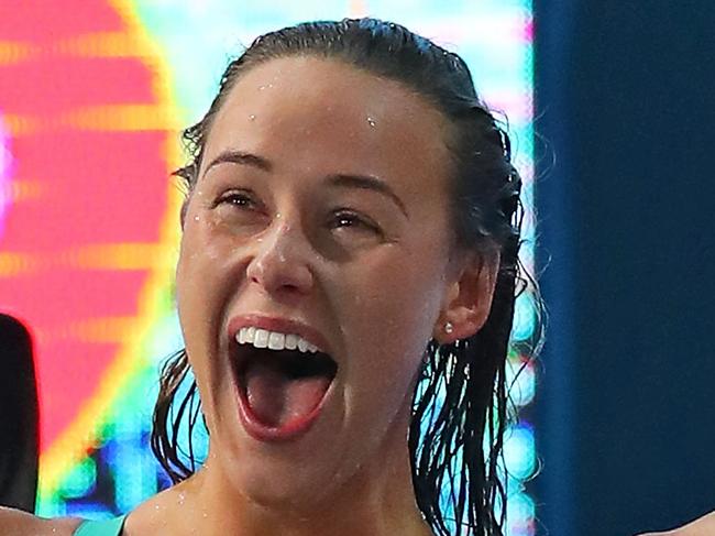 GOLD COAST, AUSTRALIA - APRIL 07:  Brianna Throssell, Leah Neale and Emma McKeon of Australia cheer on teammate Ariarne Titmus during the Women's 4 x 200m Freestyle Relay Final on day three of the Gold Coast 2018 Commonwealth Games at Optus Aquatic Centre on April 7, 2018 on the Gold Coast, Australia.  (Photo by Scott Barbour/Getty Images)