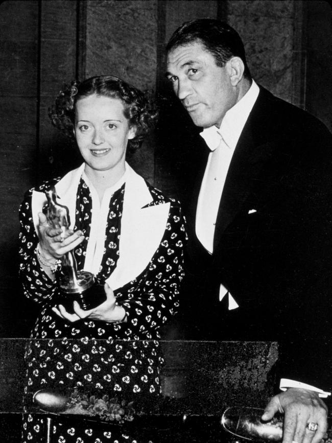 Bette Davis “unsuitably gowned”.