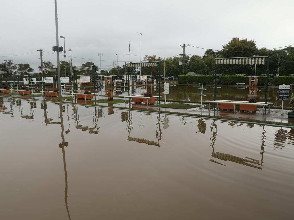 Camden a day after another flood in the area in two weeks . The Camden sports club and Bowling club flooded again after most repairs from the last flood were being completed.