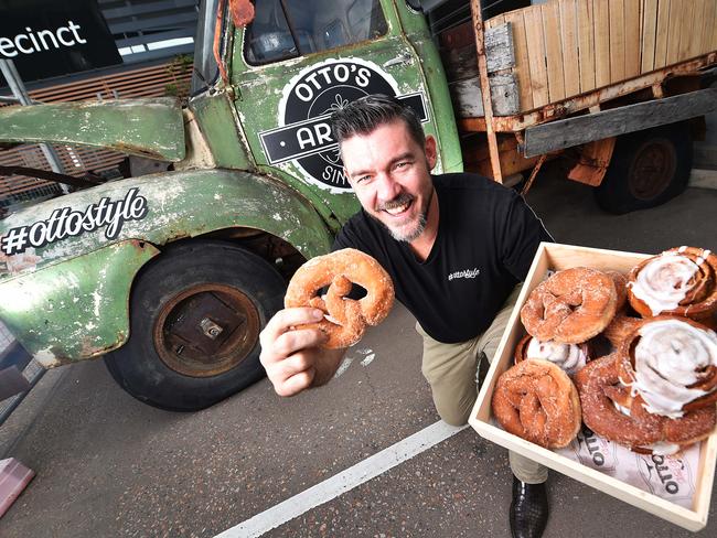 Owner of Otto's Fresh Food Market Don Peel with Otto's signature donut pretzels out the front of their new premises in Idalia. Picture: Zak Simmonds