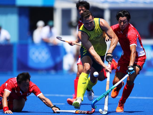 Tom Craig battles to get past opponents Genki Mitani and Masaki Ohashi. Picture: Getty