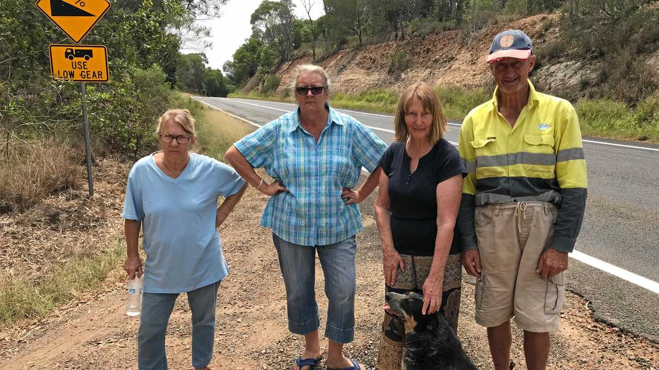 SAFETY CONCERNS: Christine Harding, Jo Hanson, Evelyn Ness Wilson, Bill Ness Wilson and Buster the dog want to see access to their Blackbutt homes become safer. Picture: Marguerite Cuddihy