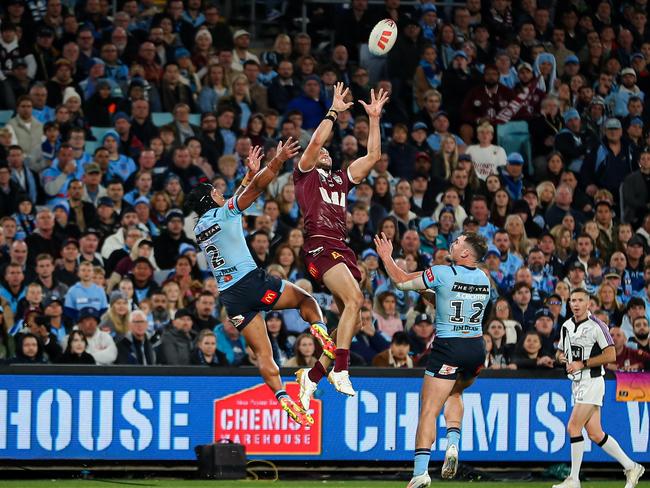 Xavier Coates and Brian To'o competing for the footy.