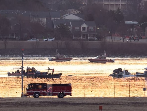 Emergency personnel workers at the site of the crash between a US Army Black Hawk helicopter and an American Airlines Bombardier jet. Picture: Kevin Lamarque/Reuters/WSJ