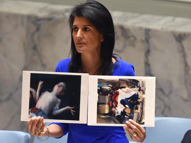 US Ambassador to the UN, Nikki Haley, held up photos of the Syrian victims as she addressed the UN Security Council. Picture: AFP/Timothy A Clary