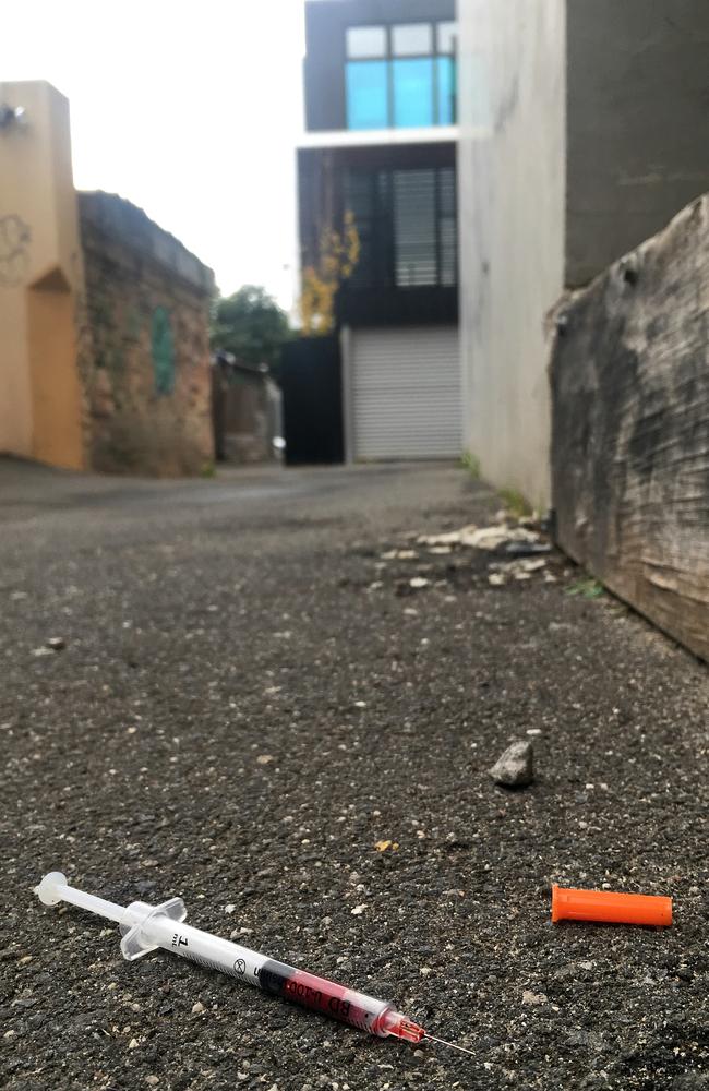 A blood-filled needle in a Richmond laneway after a safe injecting room opened nearby last week. Picture: Nicole Garmston