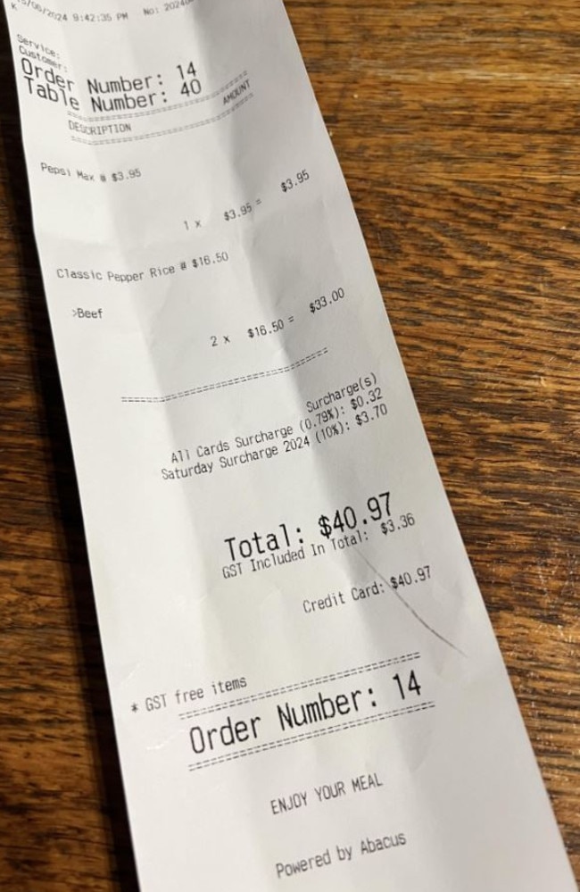 A furious diner has lashed out at the rising issue of ‘hidden surcharges’ in restaurants after being stung with a $4 transaction fee on their bill. Picture: Reddit