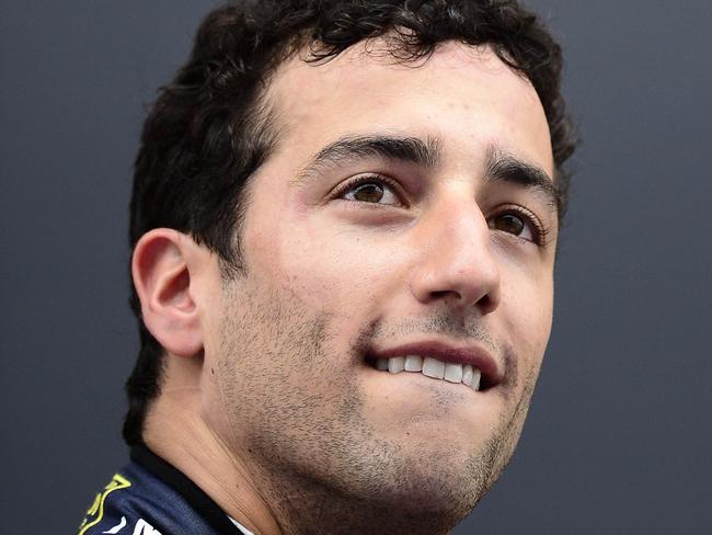 Red Bull Racing's Australian driver Daniel Ricciardo celebrates on the podium after the Spanish Formula One Grand Prix at the Circuit de Catalunya, in Montmelo on the outskirts of Barcelona on May 11, 2014. AFP PHOTO/ TOM GANDOLFINI