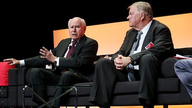 John Howard, left, and Kim Beazley discuss the budget in Brisbane. Picture: Tara Croser