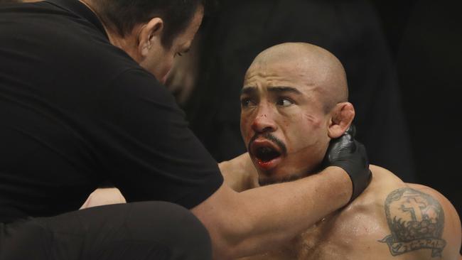 Jose Aldo reacts after losing to Max Holloway.