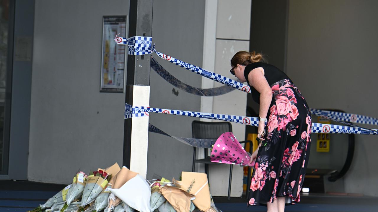 People place flowers in tribute to Vyleen White, 70, of Redbank Plains. Picture: Lyndon Mechielsen/Courier Mail