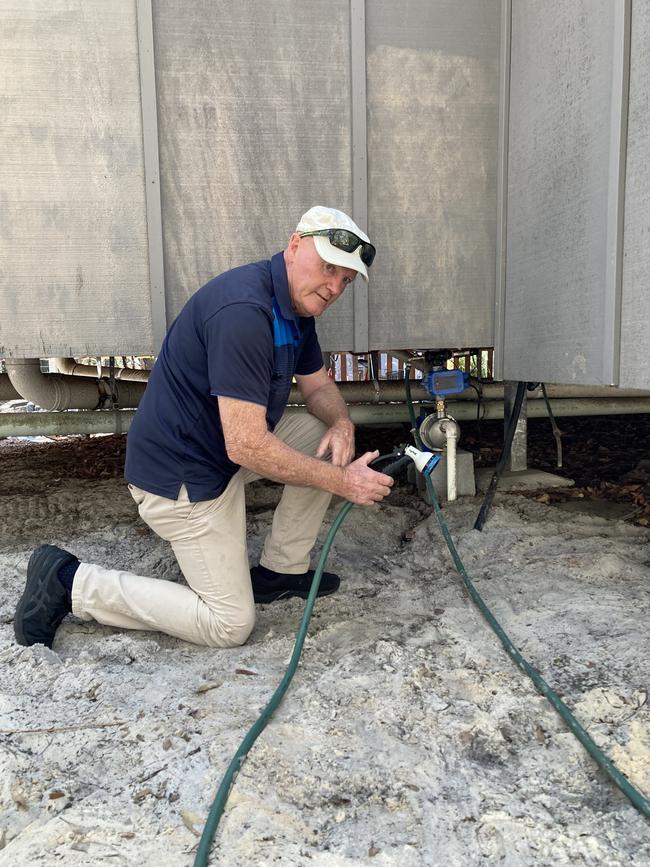 Couran Cove resident James Laverty with his spear pump. Picture: Greg Stolz