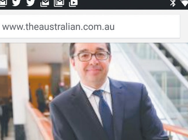 Split screen showing a story from The Australian and the Google Play store on a Nexus 6P