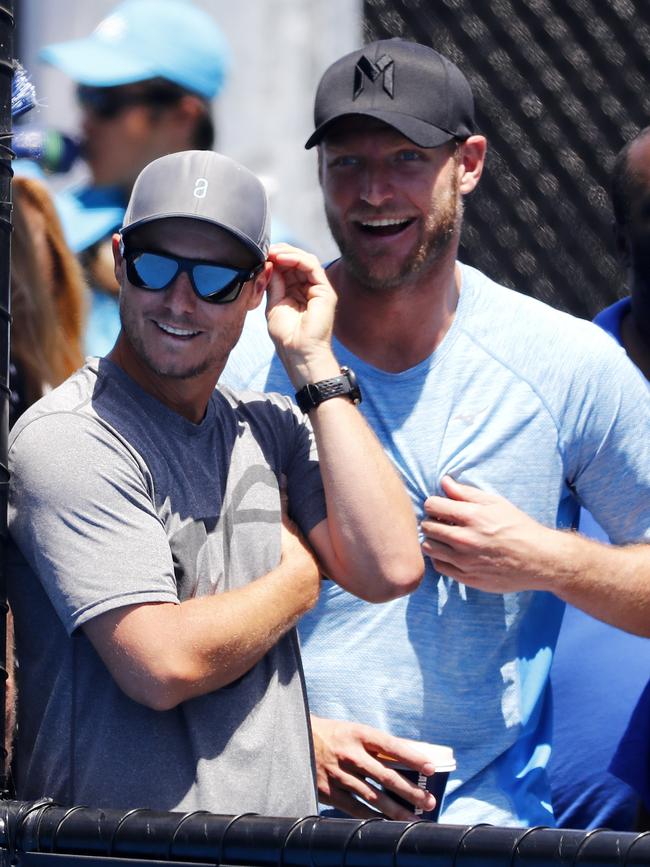 Lleyton Hewitt and Sam Groth watch on the wildcard playoffs in 2017. Picture: Michael Klein