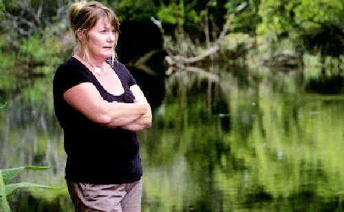 Looking at the floodwater run-off from surrounding farms Jancine Harrison, of Woodburn, says another fish kill is on the way. Picture: Jay Cronan