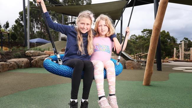 Sisters Chloe Weldon 9 and Eliza Weldon 7 of Blackmans Bay try out the new playground. Picture: Nikki Davis-Jones