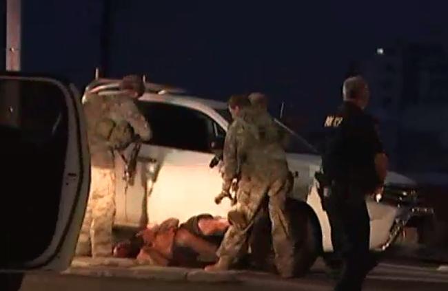 A still from an ABC news video of the man being arrested by police in Darwin after shootings. Picture: ABC Darwin