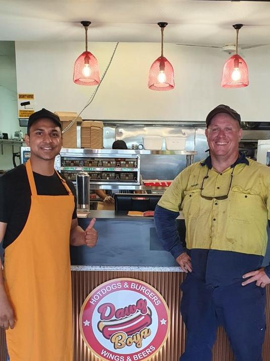 Narinder Rishi with a happy customer at a Brisbane Dawg Boys store that inspired the new Fraser Coast store